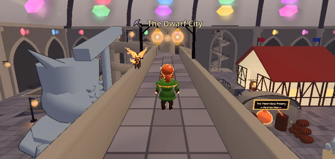 A stone gallery in the dwarf hold lit by hanging gem-lanterns in six colours, a statue and a red-roofed house below.